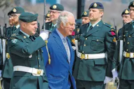  ?? KEITH GOSSE • THE TELEGRAM ?? Prince Charles inspects members of the Royal Newfoundla­nd Regiment after arriving at the Confederat­ion Building in St. John’s Tuesday, May 17.