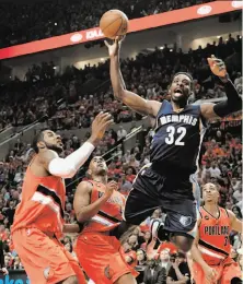  ?? Steve Dykes / Getty Images ?? Memphis’ Jeff Green soars to the basket as he is fouled by Portland’s Arron Afflalo (4) in the second quarter.