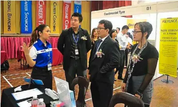  ??  ?? Dr Chee (third from left), Student Services Department head, Florence Kuek (right) and Tan visiting the booths at KBU’s career showcase.