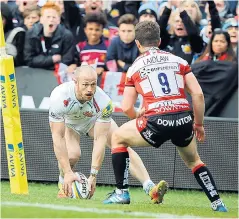  ??  ?? In at the corner: James Short touches down for the third Exeter try