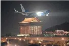  ?? IMAGES FILE SAM YEH/AFP VIA GETTY ?? A U.S. military aircraft with House Speaker Nancy Pelosi on board prepares to land at Sungshan Airport in Taipei on Aug. 2.