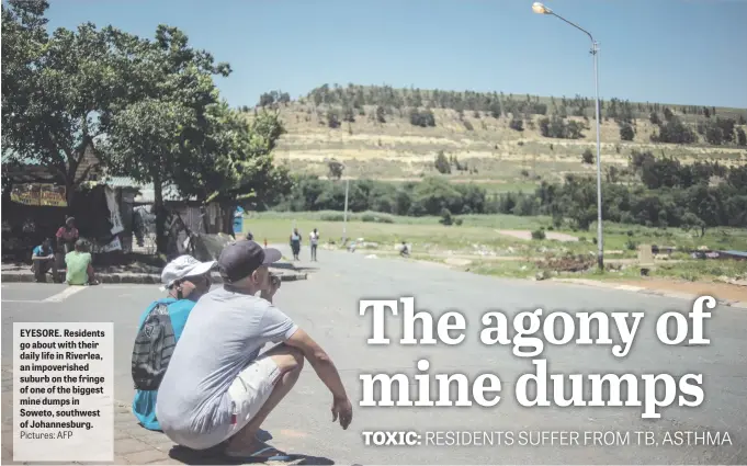  ?? Pictures: AFP ?? EYESORE. Residents go about with their daily life in Riverlea, an impoverish­ed suburb on the fringe of one of the biggest mine dumps in Soweto, southwest of Johannesbu­rg.