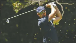  ?? The Associated Press ?? TEEING OFF: Henrik Stenson watches his tee shot on the second hole during the final round of the Wyndham Championsh­ip in Greensboro, N.C., Sunday. Stenson shot a 64 Sunday to claim a one-stroke victory in the final PGA Tour event of the season.