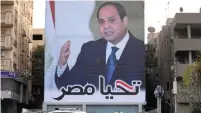  ?? (Mohamed Abd El Ghany/Reuters) ?? ‘LONG LIVE EGYPT,’ says the election poster for President Abdel Fattah al-Sisi in Cairo last month.