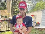  ?? Ben Crump Law ?? DAUNTE WRIGHT holds his son, Daunte Jr., at his first birthday party. Wright was fatally shot April 11.