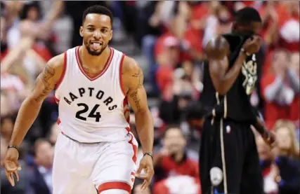  ?? FRANK GUNN, THE CANADIAN PRESS ?? Raptors guard Norman Powell celebrates a three-pointer against the Milwaukee Bucks in the second half of Game 5 in Toronto on Monday night.