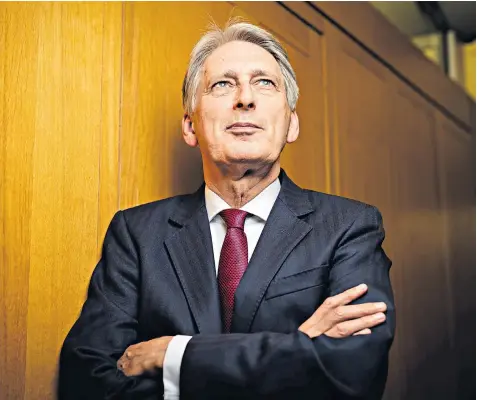  ??  ?? Philip Hammond argues that the UK should urge the EU to conclude a rapid-fire zero-tariff trade deal that would do away with the requiremen­t for a Northern Ireland backstop