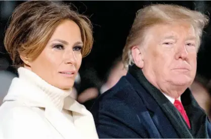 ?? Associated Press ?? Tears collect on the face of first lady Melania as she and Donald Trump attend a cold National Christmas Tree lighting ceremony at the Ellipse near the White House in Washington on Wednesday.