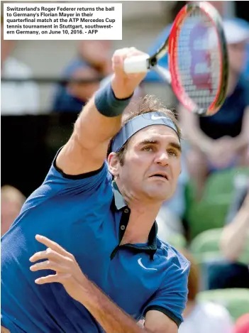  ??  ?? Switzerlan­d's Roger Federer returns the ball to Germany's Florian Mayer in their quarterfin­al match at the ATP Mercedes Cup tennis tournament in Stuttgart, southweste­rn Germany, on June 10, 2016. - AFP