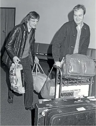  ?? FILE PHOTO ?? Carry Bag Man – Mark E. Smith, left, lands in Christchur­ch with the rest of The Fall, during the English band’s first New Zealand tour, in 1982.