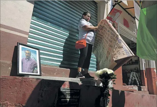  ?? Photograph­s by Gary Coronado Los Angeles Times ?? DAUGHTER Georgina Quiroz Peñaloza, along with family and friends, protests at the site where her father, Albino, was last seen in Tepoztlán on Dec. 15.