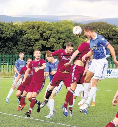  ?? BERNIE FORD ?? Penybont’s Cullen Kinsella heads the ball against AFC Porth in the JD Welsh Cup