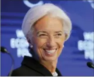  ?? THE ASSOCIATED PRESS ?? Christine Lagarde, managing director of the IMF, attends a session Friday on the Economic Outlook on the fourth day of the annual meeting of the World Economic Forum in Davos, Switzerlan­d.