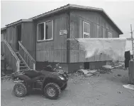  ?? THE CANADIAN PRESS / FILES ?? A polar bear hide dries outside a house in Nunavut. The federal government is expected make a long-term commitment to Indigenous housing in next week’s budget.