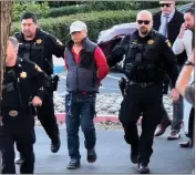  ?? COURTESY OFKATI MCHUGH ?? A video screen capture shows Chunli Zhao, 67, being taken into custody in Half Moon Bay. He was indicted Tuesday by a grand jury and faces seven counts of first-degree murder.