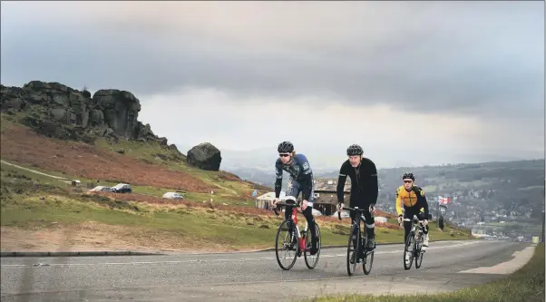  ?? PICTURE: BRUCE ROLLINSON. ?? CHALLENGE: Cyclists Simon Gueller, Thomas Wood and Connor Palliser ride up past the Cow and Calf in Ilkley where the second stage of the 2018 Tour de Yorkshire will finish.