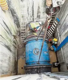  ??  ?? Good show: Workers carrying out the equipment replacemen­t works at Sungai Semenyih Water Treatment Plant.