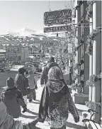  ?? PROVIDED BY MATTHEW INDEN/ MILES/ COLORADO TOURISM ?? Visitors in Breckenrid­ge take a break from the slopes to do some shopping downtown.