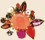  ??  ?? THE ROSIE, which is made with pink opal, rhodolite, star sapphire, garnet, red agate, London blue topaz, carnelian, and pearl, can be worn three ways.