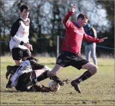  ??  ?? Kenneth Cahill of St. Leonards tries to keep his footing.