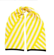  ??  ?? Yellow stripe scarf | £42 Thick, cosy and oversized for misty and mellow mornings. misspompom.com