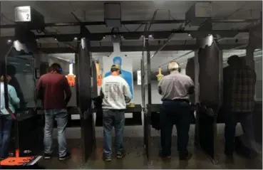  ?? TANIA BARRICKLO — DAILY FREEMAN ?? Patrons of Safe Shoot in the line up in one of the ranges for target practice.