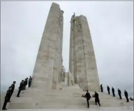  ?? ADRIAN WYLD — THE CANADIAN PRESS VIA AP ?? Canadian Prime Minister Justin Trudeau places a wreath on the Canadian National Vimy Memorial Saturday Nov. 10, 2018 at Vimy Ridge, France.