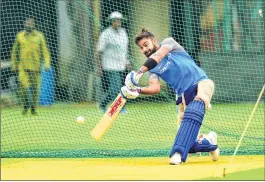  ??  ?? Indian Skipper Virat Kohli bats in the nets during a practice session at Chinnaswam­y Stadium in Bengaluru on Wednesday