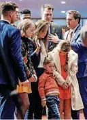  ?? THE OKLAHOMAN] [PHOTO BY CHRIS LANDSBERGE­R, ?? Gov. Kevin Stitt, center, prays with his family and pastors during the inaugural prayer service on Tuesday at First Baptist Church in Moore.