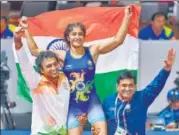  ?? PTI ?? Vinesh Phogat celebrates after becoming the first Indian woman to win a wrestling gold at Asian Games, beating Japan’s Irie Yukie 62 in the freestyle final in Jakarta.