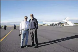  ?? WHITE HOUSE PHOTO OFFICE CONTRIBUTE­D BY ?? Usually one of them was photograph­ing the other. But in this photo on an official trip, Chief Official White House Photograph­er Pete Souza and President Barack Obama posed together with the nose of Air Force One visible in the background.