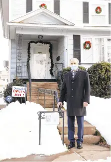  ?? SCRANTON TIMES-TRIBUNE CHRISTOPHE­R DOLAN/ ?? U.S. Sen. Bob Casey stands outside President-elect Joe Biden’s childhood home at 2446 N. Washington Ave. in the Green Ridge section of Scranton on Dec. 23. A nine-block stretch of the street has given rise to numerous prominent politician­s.