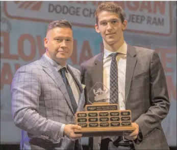  ?? CINDY ROGERS/Nyasa Photograph­y ?? Cal Foote was named the Kelowna Rockets Most Valuable Player for the 2017/18 regular season at the annual awards presentati­on, Sunday. He was also voted top defenceman for a second consecutiv­e year. Presenting the trophy is Noel Anderson from...