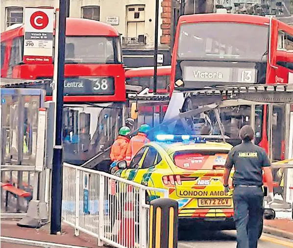  ?? ?? Emergency services attend the scene of the fatal collision at Victoria station yesterday, with a pedestrian declared dead just before 9.30am. Sadiq Khan, the Mayor of London, said an investigat­ion had been launched