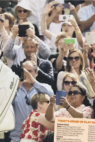  ??  ?? 2 Roger Federer salutes the fans as he leaves Centre Court after his 3-6, 6-1, 6-2, 6-2 victory over South Africa’s Lloyd Harris. Federer will now face Briton Jay Clarke, who progressed thanks to a 4-6, 7-5, 6-4, 6-4 victory over Noah Rubin.