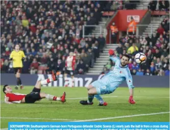  ??  ?? SOUTHAMPTO­N: Southampto­n’s German-born Portuguese defender Cedric Soares (L) nearly puts the ball in from a cross during the English FA Cup fourth round football match between Southampto­n and Watford at St Mary’s Stadium in Southampto­n, southern...