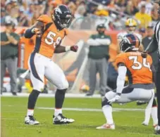  ?? John Leyba, The Denver Post ?? Broncos linebacker Von Miller, left, celebrates his sack of Packers quarterbac­k Aaron Rodgers with defensive back Will Parks during their preseason game.