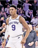  ?? N.Y. Post: Charles Wenzelberg ?? DOING IT ALL: RJ Barrett scored 14 points in the third quarter while playing lock-down defense on Boston’s Jayson Tatum in the Knicks’ season opener.