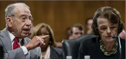  ?? Andrew Harnik ?? The Associated Press Senate Judiciary Committee Chairman Chuck Grassley, R-iowa, left, accompanie­d by Sen. Dianne Feinstein, D-calif., speaks Thursday during a committee markup meeting on Capitol Hill.