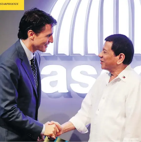  ?? MARK CRISTINO/POOL PHOTO VIA AP ?? Prime Minister Justin Trudeau shakes hands with Philippine President Rodrigo Duterte before the opening ceremony of the 31st ASEAN Summit in Manila on Monday. Duterte has invited Trudeau to a working lunch on Tuesday ahead of the ASEAN-affiliated East...