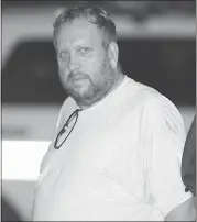  ?? PHOTOS BY JIM YOUNG — THE ASSOCIATED PRESS ?? Andrew Warren, an Oxford University financial officer, arrives at a police station escorted by Chicago police.