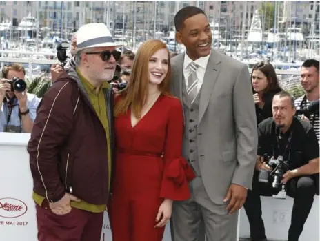  ?? ALASTAIR GRANT/THE ASSOCIATED PRESS ?? Pedro Almodovar, left, with fellow jury members Jessica Chastain and Will Smith, says he is fighting to preserve the hypnosis of large-screen viewing.