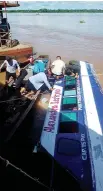  ??  ?? Murky terror...the capsized vessel is recovered in Peru