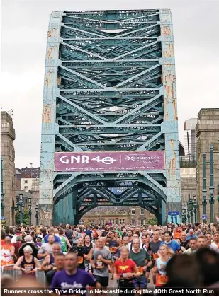  ?? ?? Runners cross the Tyne Bridge in Newcastle during the 40th Great North Run