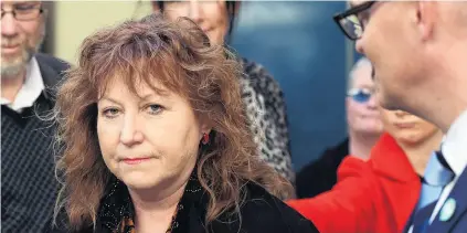  ?? PHOTO: STEPHEN JAQUIERY ?? Brought low . . . Clare Curran is supported by fellow Dunedin MP David Clark (right) at a media conference in Dunedin yesterday.