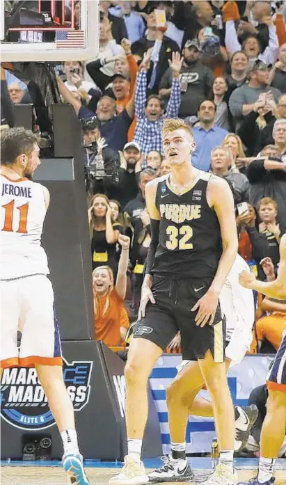  ?? GETTY ?? making a game-tying shot over Matt Haarms (32) of Purdue to force overtime on Saturday night.