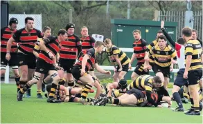  ??  ?? Chaz Meddick scoring his second try for Avon (red &amp; black) in the victory against Hornets 2nd