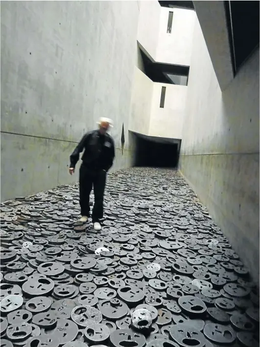  ??  ?? SILENT SCREAM: 10 000 metal faces on the floor of the Jewish Museum. Below is the Berlin Cathedral