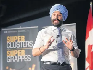  ?? CP PHOTO ?? Navdeep Bains, minister of Innovation, Science and Economic Developmen­t, announces winning proposals under the $950-million Innovation Superclust­ers Initiative in Ottawa on Thursday.