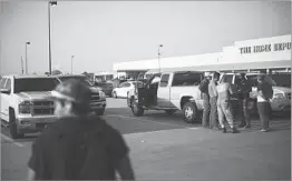  ?? JOHN TAGGART/FOR THE WASHINGTON POST ?? Day laborers gather at a Home Depot parking lot in Houston looking for work as the region starts to clean up from Hurricane Harvey, which puts them in high demand.